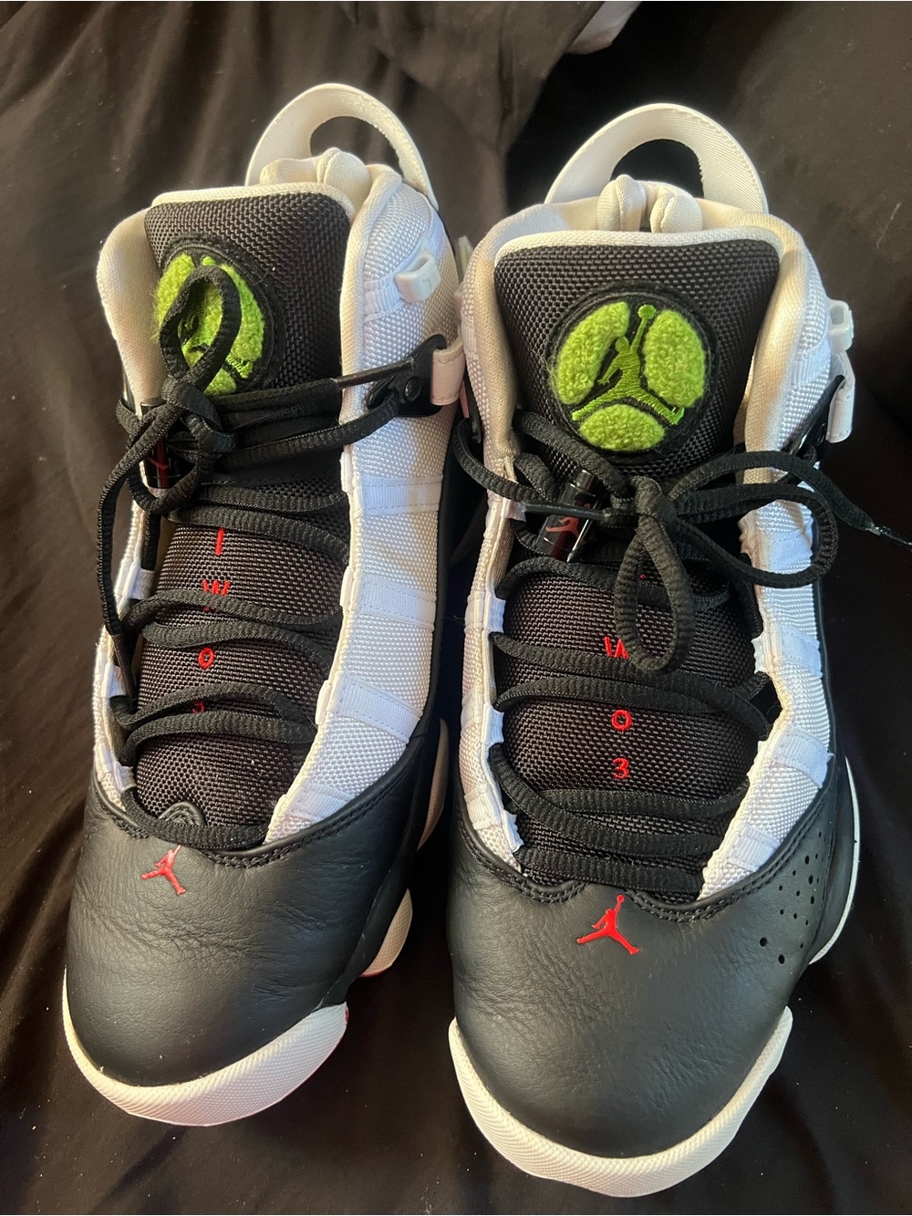 MensBlack and White Basketball Sneakers with Green Accents
